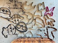 Spread of assorted metal cookie cutters showing variety of shapes