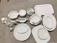 Overview of full lot showing dinnerware, serveware and bakeware pieces