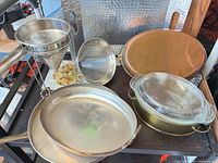 Group shot of all cookware, strainers, casserole and tray