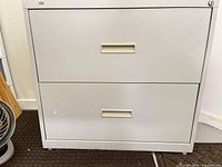 Front view of beige 2-drawer metal lateral filing cabinet