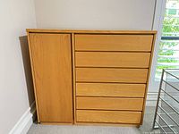 Front view of dresser with closed cabinet and drawers