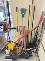 Group shot of all tools leaning against wall