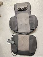 Front view of Snailax massage seat cushion with remote attached