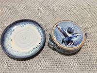 Casserole with lid alongside matching plate