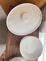 Fluted casserole lid and matching bowl visible