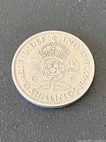 close view of coin reverse detail showing date and design
