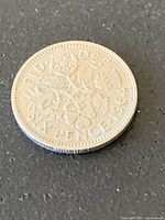 Reverse of 1964 British sixpence showing floral emblems and date