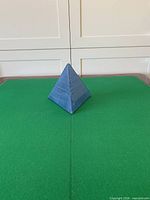 front view of blue glass pyramid