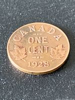 Reverse of 1928 Canada one-cent coin showing denomination and date