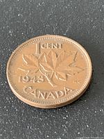 Reverse of 1943 Canada 1 cent showing maple leaves, date, denomination