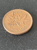 Reverse of 1946 Canada one-cent coin showing maple leaves and date