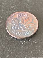 Reverse showing maple-leaf design, date 1950 and CANADA legend