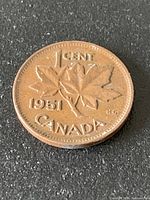 Reverse of 1951 Canada cent showing maple leaves and legends