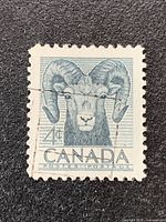 Front view of Canada 4¢ Bighorn Sheep stamp showing full design and perforations