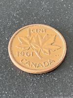 Reverse of 1961 Canada 1-cent coin showing maple leaves and date