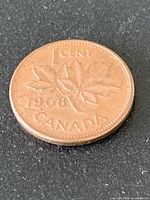 Reverse of 1968 Canadian one-cent coin with maple leaf design and date