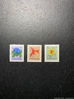 Front view of all three stamps on black background