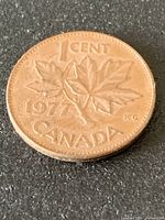 Reverse of 1977 Canada 1-cent coin showing maple leaf design and date