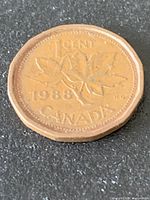 Reverse side showing maple leaf design and 1988 date
