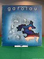 Front cover of Garolou album showing artwork, moderate edge wear visible