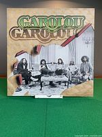 Front cover showing Garolou band photo and logo
