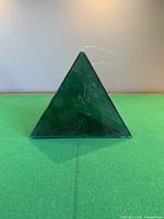 Front view of translucent green glass pyramid
