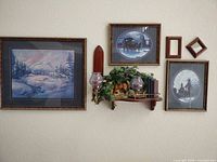 Overall wall grouping showing prints, shelf, mirrors