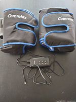 Front view of both leg wraps with controller and cables