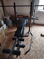 Legacy 295 bench with uprights, leg developer, straight barbell and pulley system