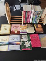 Full lot overview showing all books and wood rack