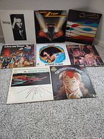 Front covers of all eight albums