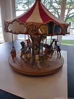 Oblique view showing carousel animals and base