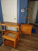 All three pieces: corner cabinet and two glass-top display tables