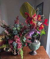 Two silk flower arrangements on table, full view