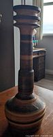 Full view of ceramic candlestick showing height and banded glaze