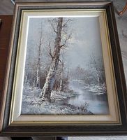 Full view of framed winter landscape painting