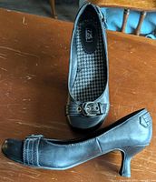 Side and top view of both black heels