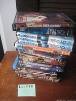 Stack of assorted DVD cases showing Jesse Stone titles and others