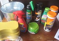 Overall view showing pail, sponges, spray bottle, Armor All and Turtle Wax products
