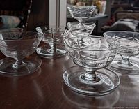 Group of stemmed dessert dishes on table