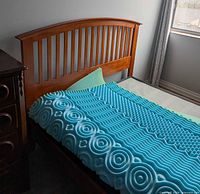 Full view of bed frame with headboard and foam topper