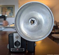 Front view of Brownie Hawkeye camera with attached flasholder