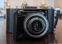 Front view showing lens, bellows and body