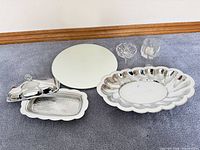 Group shot showing entire lot: platter, butter dish with lid, mirror plate, votive holder, two small vases
