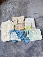 All bedding items laid out on carpet