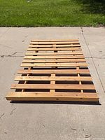 Full view of both slatted pine panels forming bed base