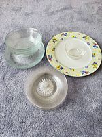 Group view of Nikko plate, glass plates and bowls