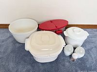 Entire set laid out on carpet showing bowls, Pasta Boat, shakers, toothpick holder