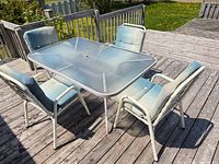 overview of dining table, four chairs and chaise lounge