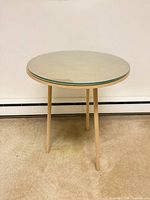 Round beech side table front view